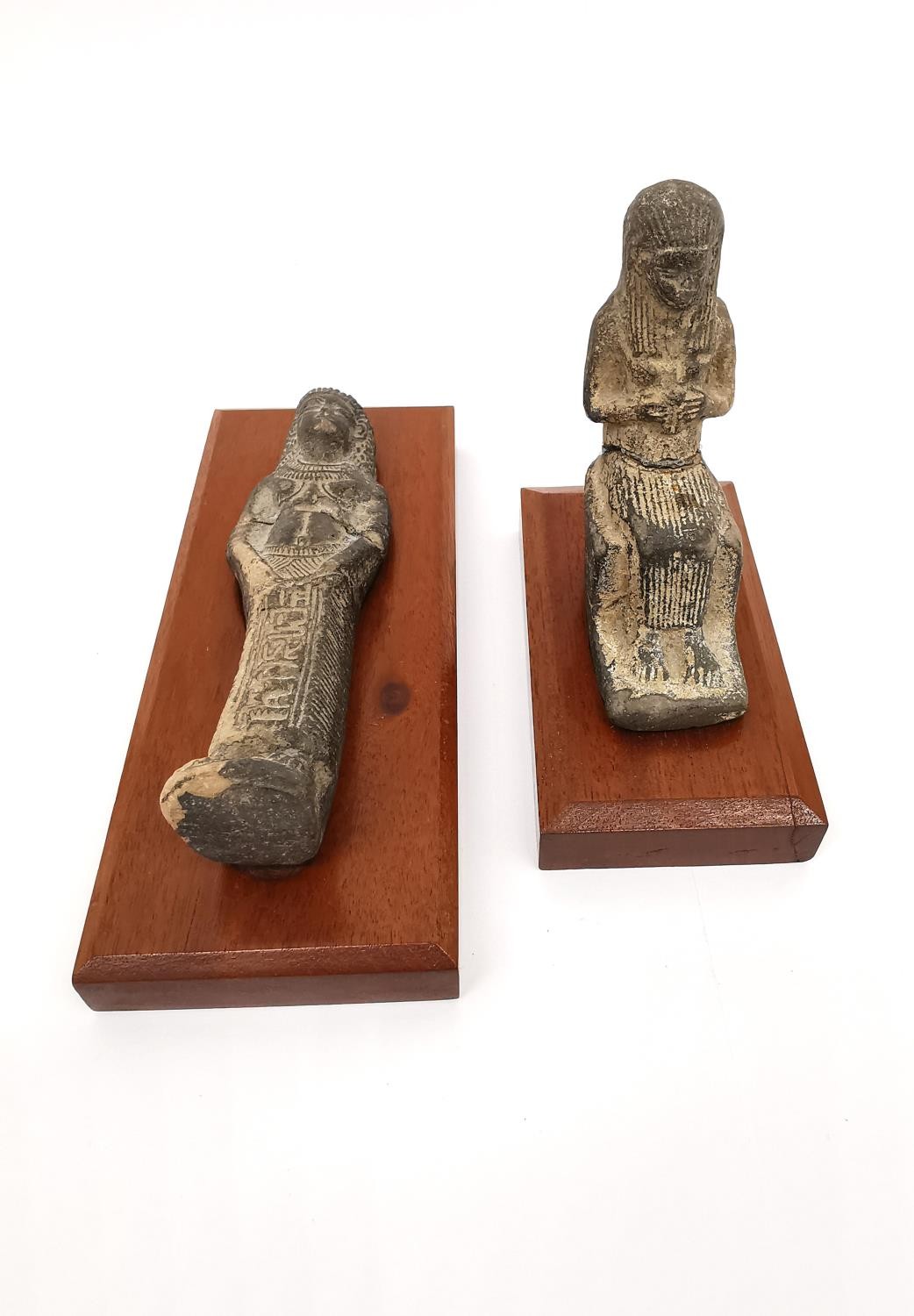 Two Egyptian-style clay ushabti on wooden plinth bases. One lying down and one seated on a - Image 2 of 9