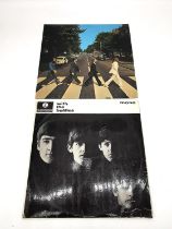 Two vintage Beatles records 'With the Beatles' and 'Abbey Road'. With the Beatles, pressing XEX