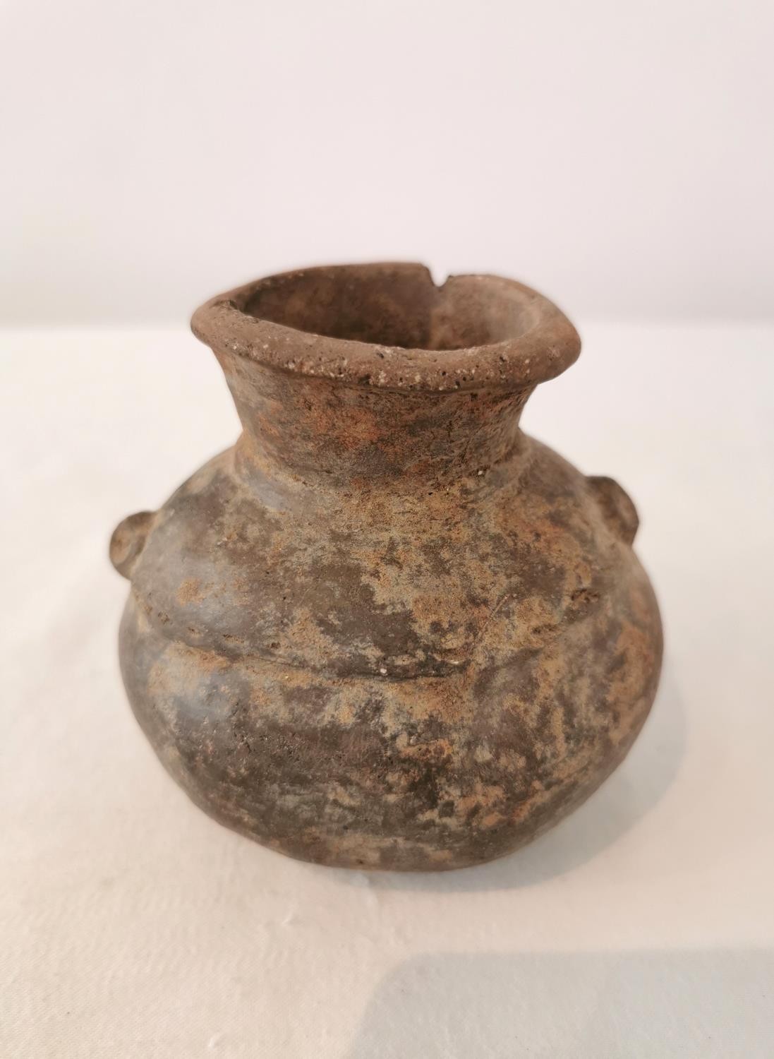 A Pre-Colombian terracotta vessel with rounded bottom and two small protrusions on the side. H.9.5 - Image 4 of 6