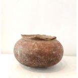 A large Pre-columbian terracotta cooking pot with rounded bottom. (rim chipped all round) H.24,