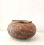 A large Pre-columbian terracotta cooking pot with rounded bottom. (rim chipped all round) H.24,