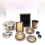 A collection of mixed silver comprising of a bon bon dish with a scalloped rim, an Indian