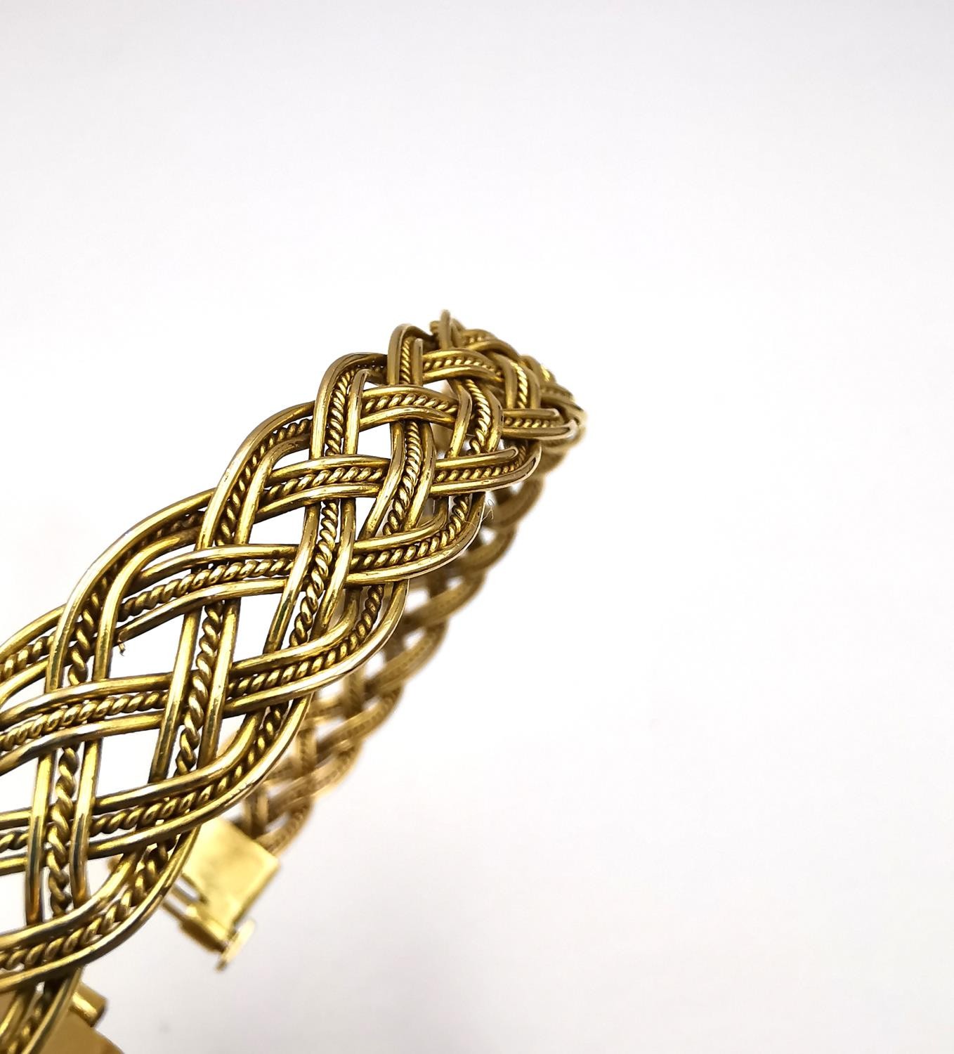 A woven gold plated wirework plaited bracelet with pin fastening. Diameter 6cm. Weight 18.62g. - Image 8 of 10