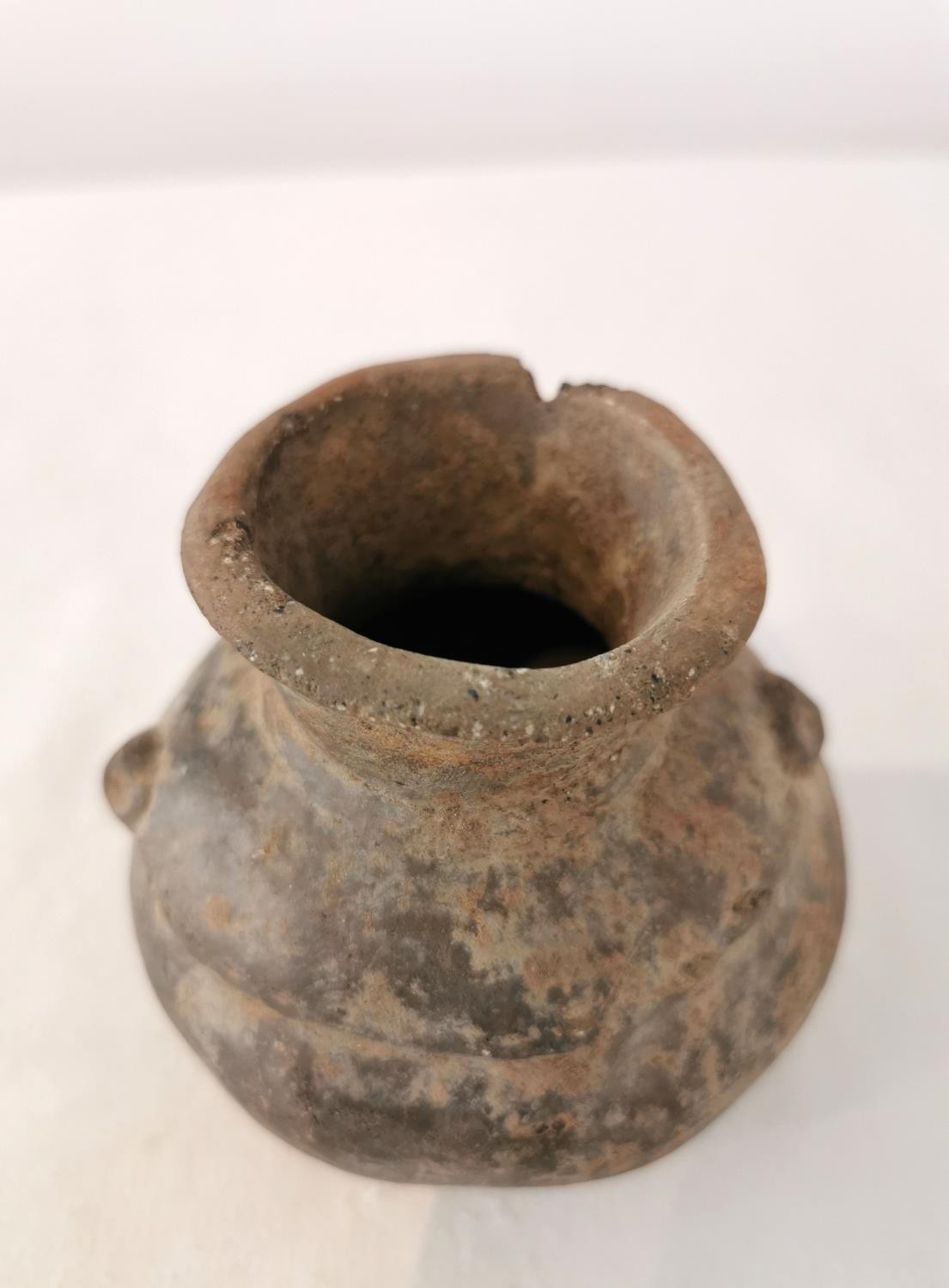 A Pre-Colombian terracotta vessel with rounded bottom and two small protrusions on the side. H.9.5 - Image 5 of 6