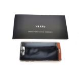 A boxed Vertu Signature touch Bentley mobile phone. The Vertu for Bentley is made from lightweight