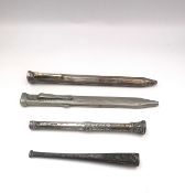 A white metal (tests as silver) repousse cheroot holder, a white metal (tests as silver) repousse