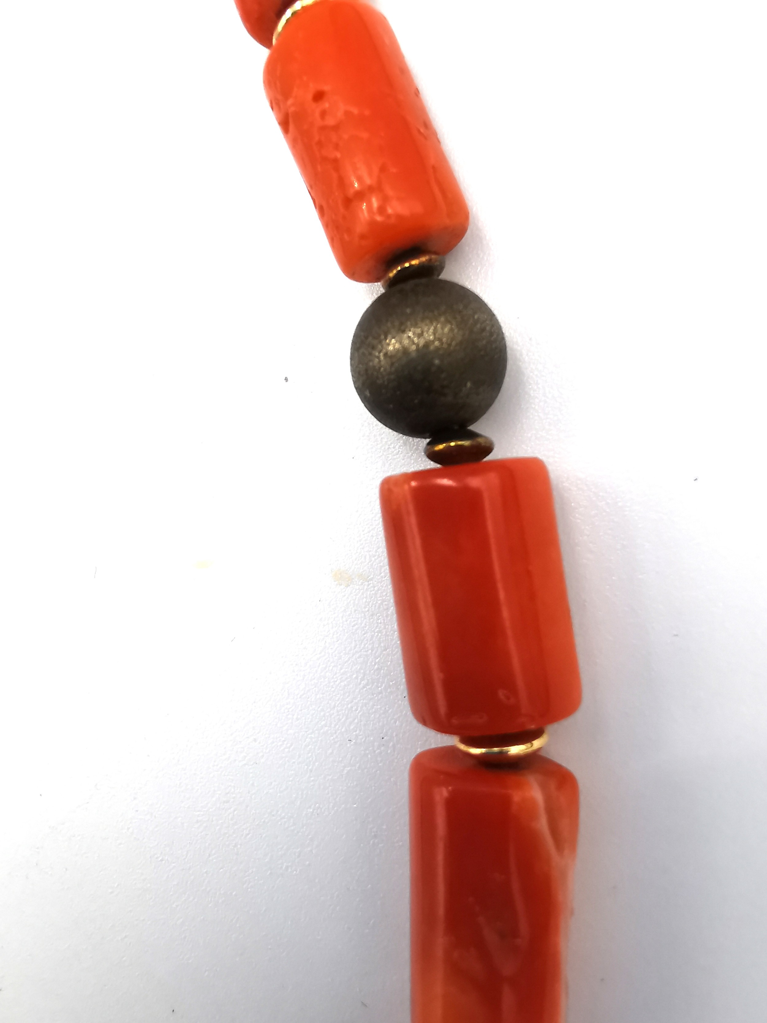 A vintage coral necklace with cylindrical metal pierced beads and gold plated spacers. Fastens - Image 3 of 6