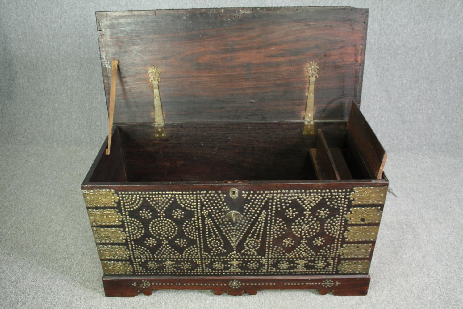 A 19th century Indian rosewood Zanzibar chest with allover studded ornament and fitted interior. H. - Image 4 of 7