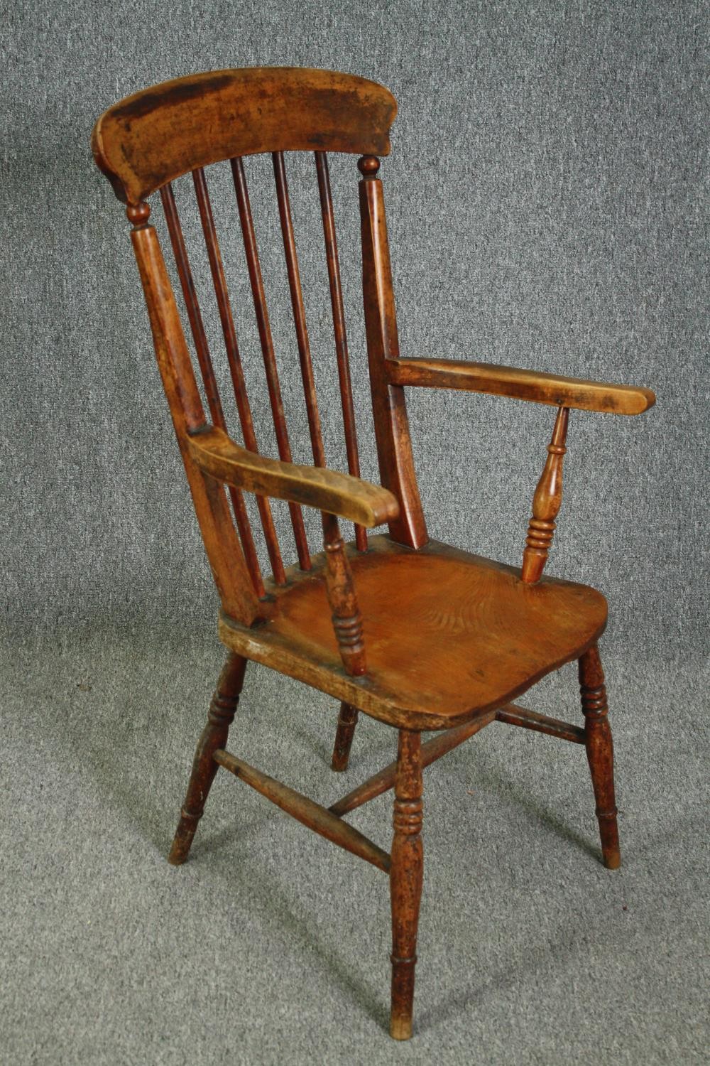 A 19th century elm seated stick back kitchen chair. - Image 2 of 5