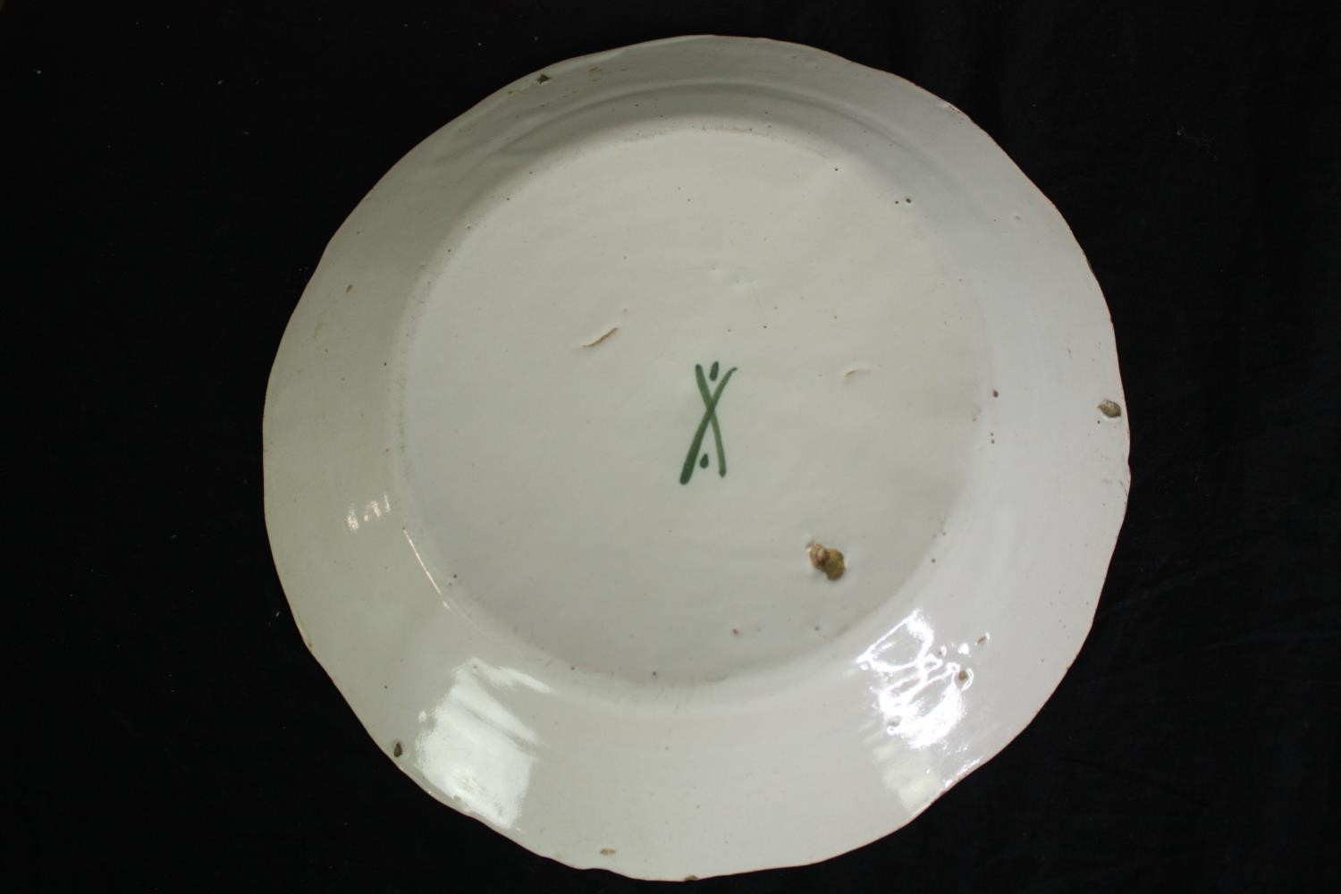 A collection of 19th century faience plates. One damaged. Dia.34cm. (largest). - Image 3 of 11