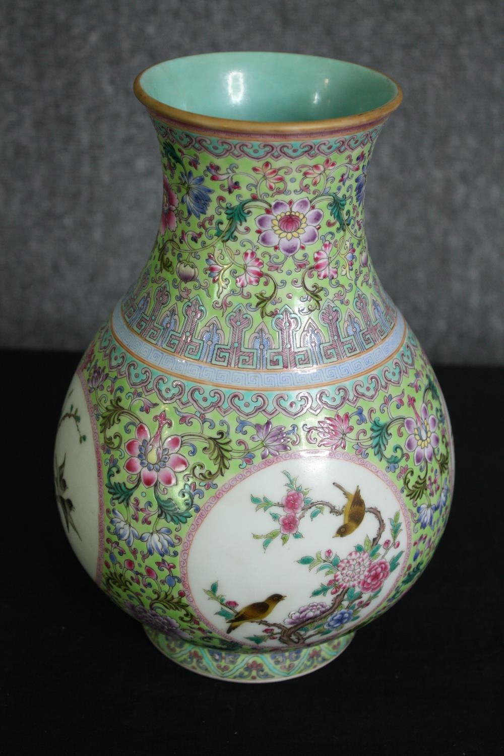 An early 20th century Famille rose hand painted porcelain vase with celadon glaze interior and base. - Image 2 of 6