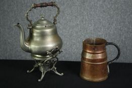 A 19th century spirit burner and a copper jug. H.37cm. (largest).