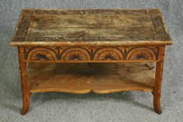 A carved oak low table. H.45 W.75 D.37cm.