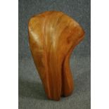 A carved and polished hardwood figure of amorphous form. H.60cm.