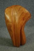 A carved and polished hardwood figure of amorphous form. H.60cm.