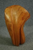 A carved and polished hardwood figure of amorphous form. H.60cm.