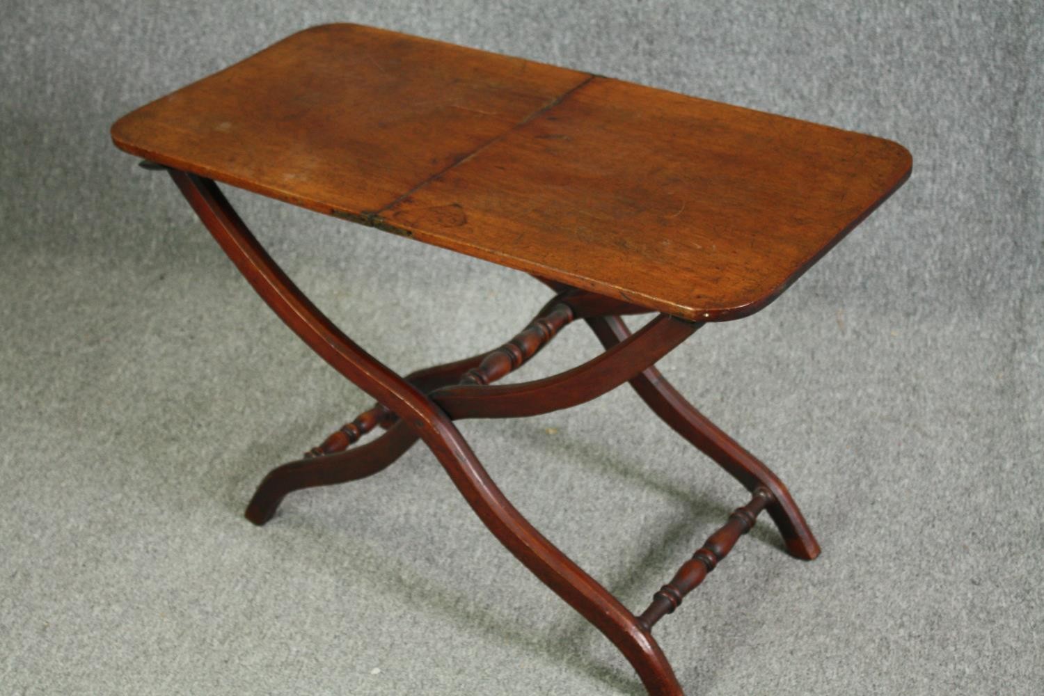 A 19th century mahogany folding campaign table, later adapted to a fixed top. H.59 W.91 W.45cm. - Image 3 of 7