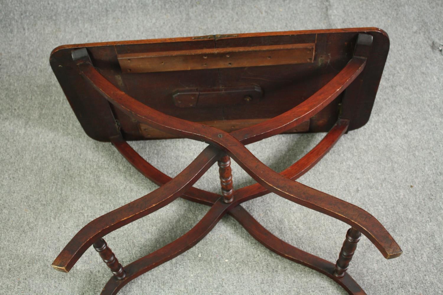 A 19th century mahogany folding campaign table, later adapted to a fixed top. H.59 W.91 W.45cm. - Image 6 of 7