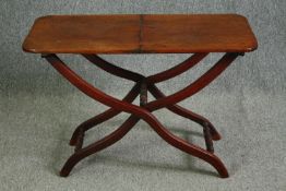 A 19th century mahogany folding campaign table, later adapted to a fixed top. H.59 W.91 W.45cm.