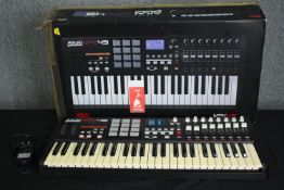 An Akai MPK49 midi keyboard. H.9 W.73 D.30cm.