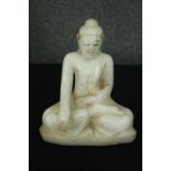 A seated alabaster Buddha figure. H.26cm.