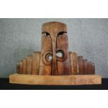 A carved hardwood abstract figure group. H.54 W.80 D.21cm.