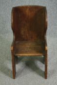 An 18th century country oak child's chair settle. H.70cm.