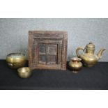 A collection of Eastern brassware and a carved hardwood framed with hinged door. H.40 W.38cm. (