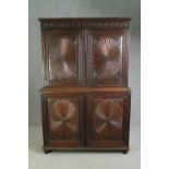 An early 19th century Anglo Indian carved hardwood linen press in two sections. H.190 W.126 D.50cm.