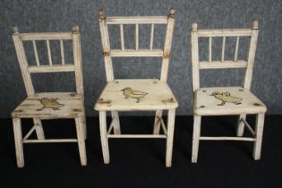 A collection of vintage distressed painted doll's or toy chairs. H.30cm. (largest).