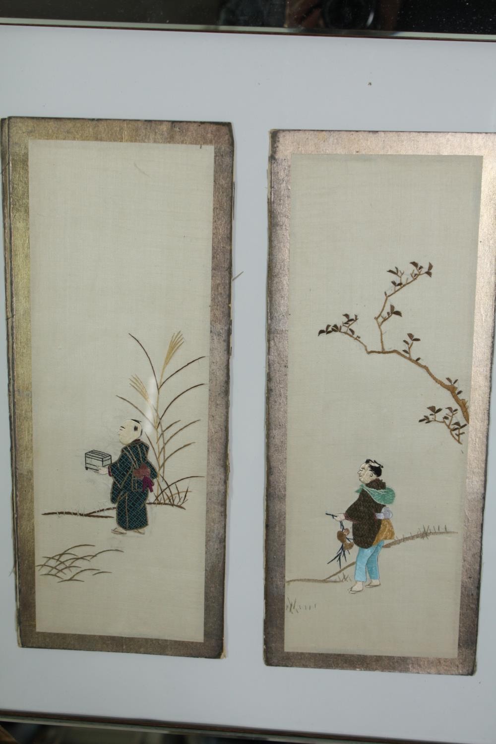 A set of eleven early 20th century Japanese silk embroidery panels depicting figures with gilded - Image 3 of 9