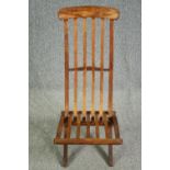 A folding slatted teak side chair. H.93cm.