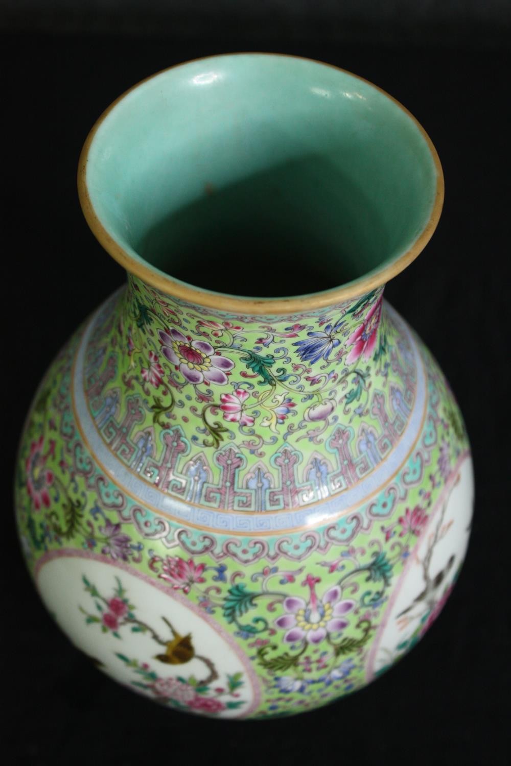 An early 20th century Famille rose hand painted porcelain vase with celadon glaze interior and base. - Image 3 of 6