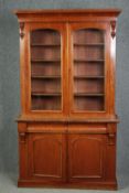 Library bookcase, 19th century mahogany, in two sections. H.211 W.120 D.45cm.