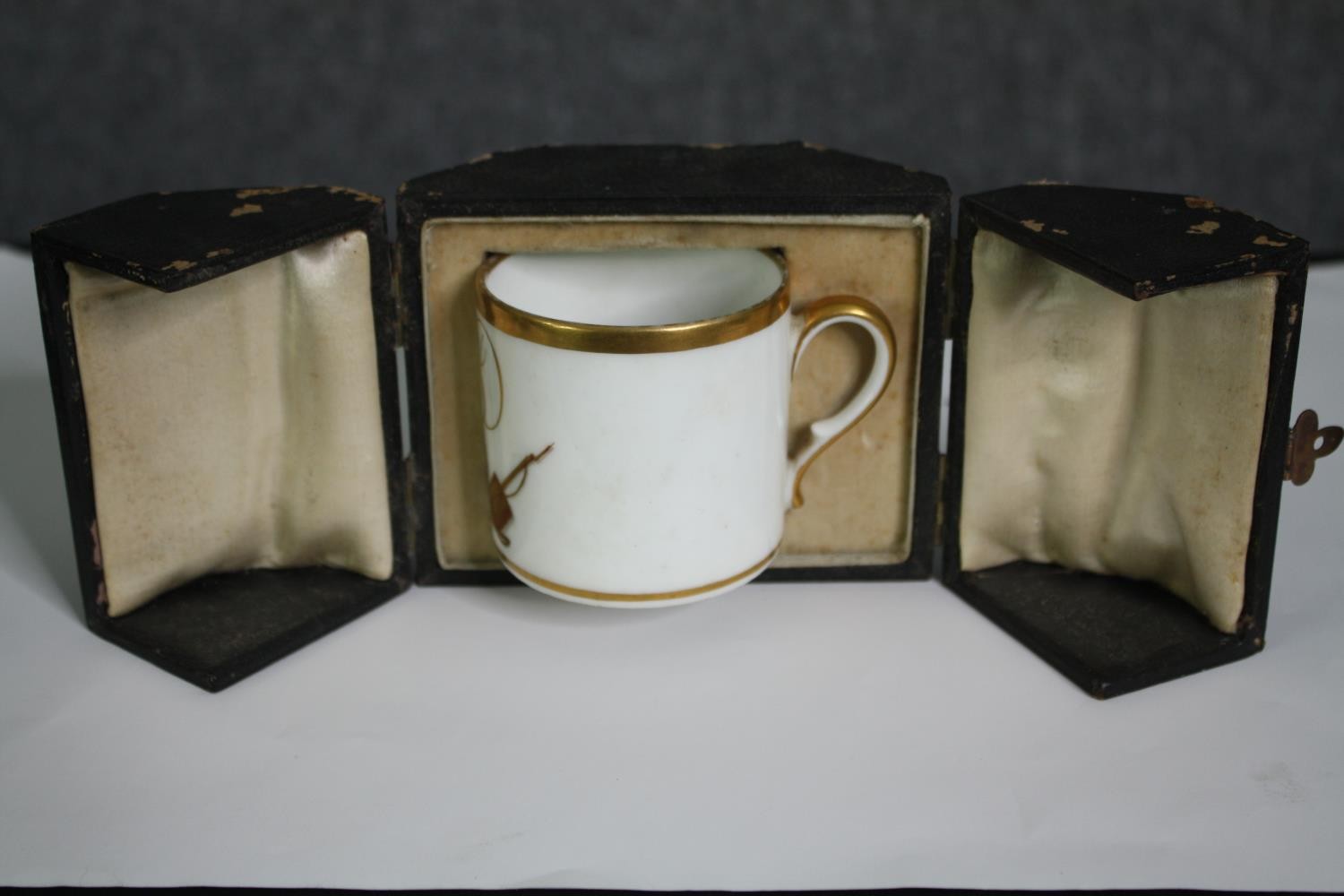 A 19th century porcelain cup, hand decorated in gilt in presentation case. H.9 W.11 D.8cm. - Image 2 of 5