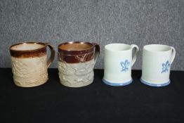 Two 19th century two tone stoneware harvest/hunting mugs of large proportions with moulded sprig