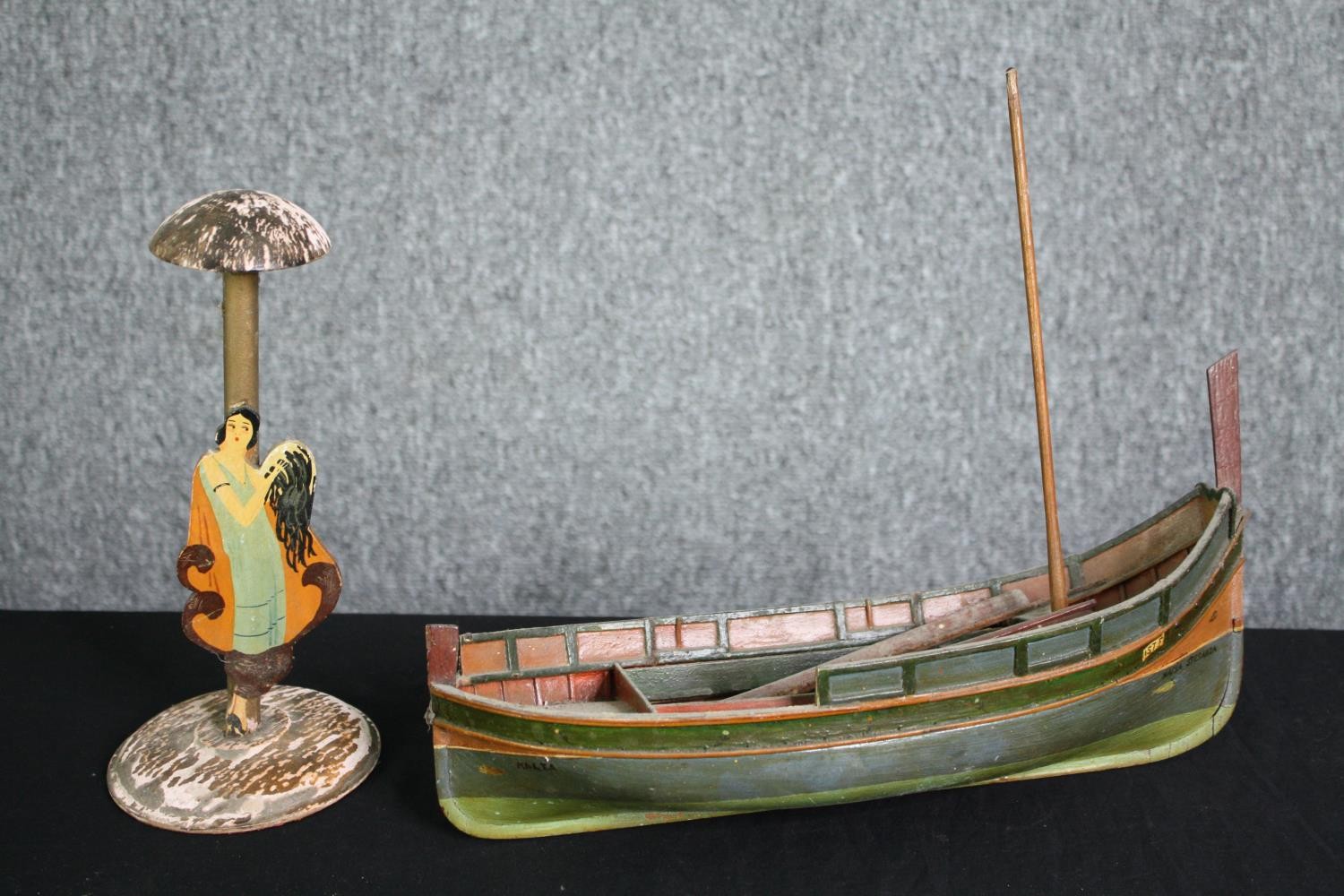 A 1920's vintage hand decorated figure and a scratch built model of a fishing boat. H.29 W.37cm. (