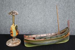 A 1920's vintage hand decorated figure and a scratch built model of a fishing boat. H.29 W.37cm. (