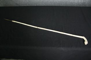 An Indian carved bone sword / walking stick. L.90cm.