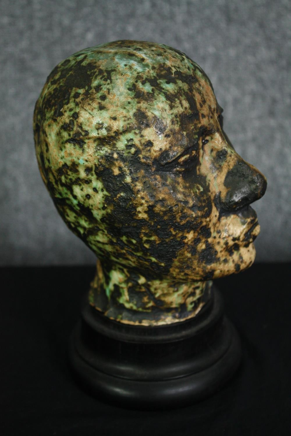 A ceramic glazed bust; man's head on ebonised socle. H.23cm. - Image 3 of 5