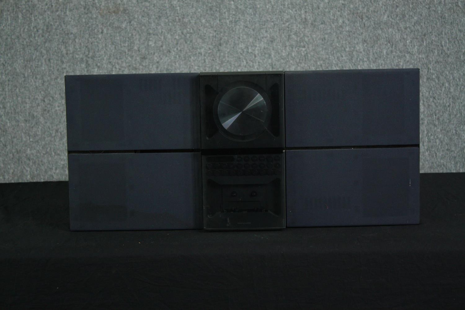 A Bang & Olufsen Beosound Century casette player. H.34 W.75 D.10cm.