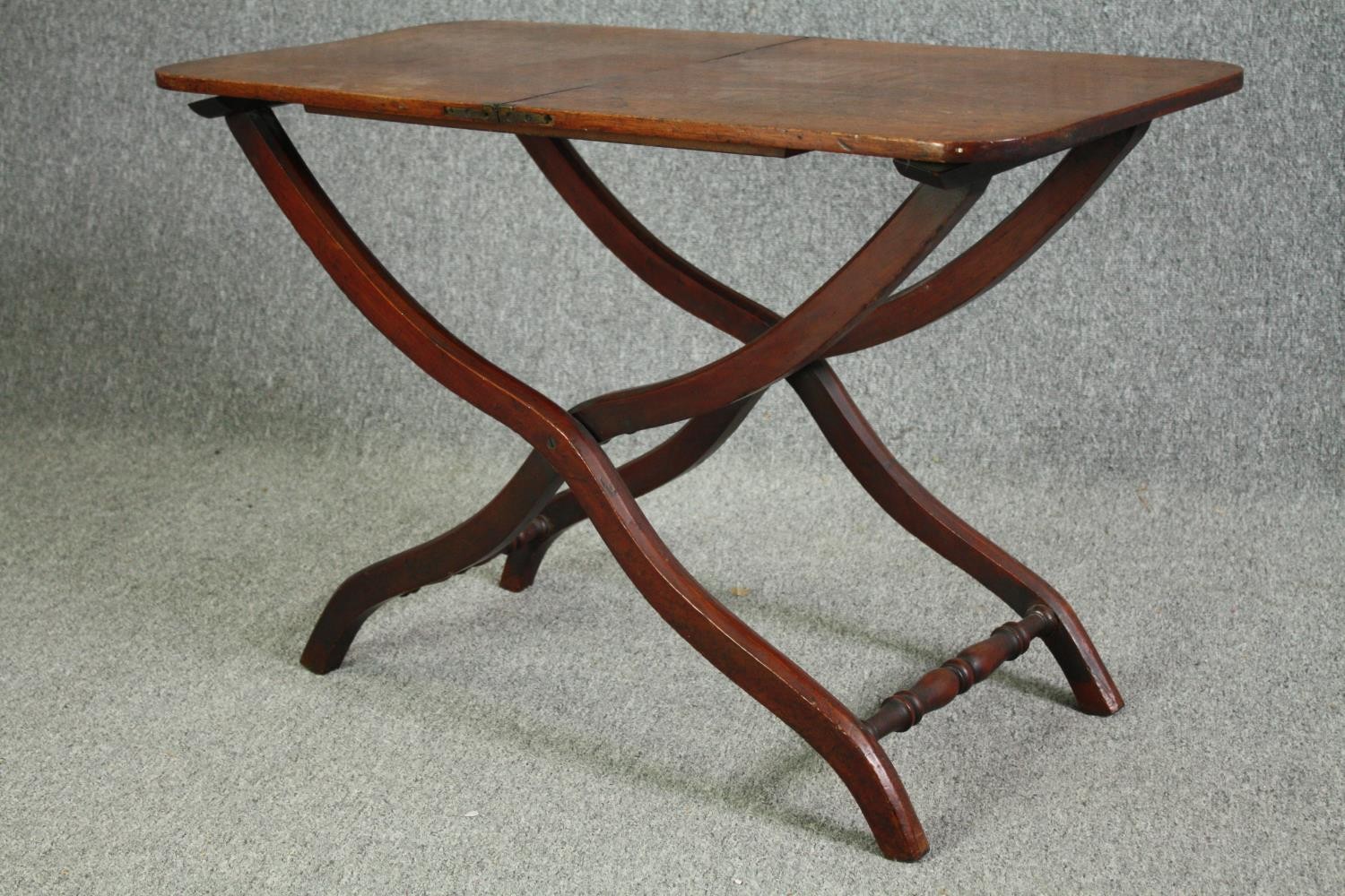 A 19th century mahogany folding campaign table, later adapted to a fixed top. H.59 W.91 W.45cm. - Image 4 of 7