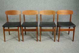 Dining chairs, a set of four mid century teak with vinyl seats.
