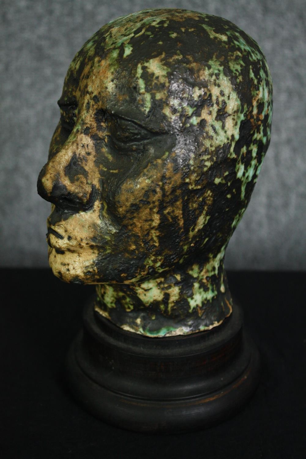 A ceramic glazed bust; man's head on ebonised socle. H.23cm. - Image 2 of 5