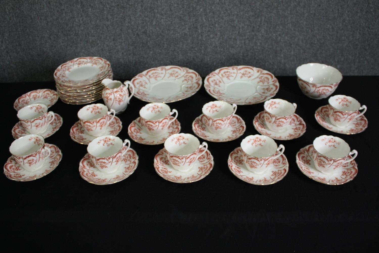A late 19th century porcelain tea service, marked to the base. Dia.24cm. (largest).