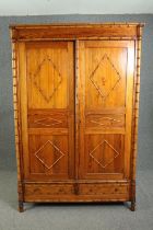 A 19th century pitch wardrobe with faux bamboo design fitted with base drawers. (This flat packs for