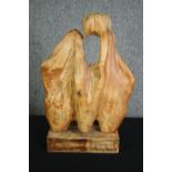 A carved abstract figure group. H.58cm.