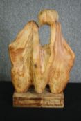 A carved abstract figure group. H.58cm.
