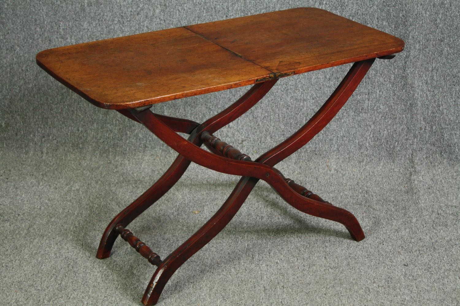 A 19th century mahogany folding campaign table, later adapted to a fixed top. H.59 W.91 W.45cm. - Image 2 of 7