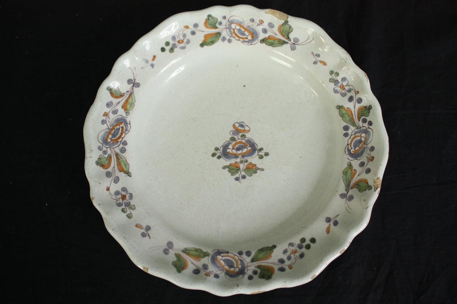 A collection of 19th century faience plates. One damaged. Dia.34cm. (largest). - Image 4 of 11